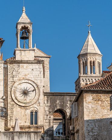 Iconic Clock Tower and bell tower of Saint Dominus Cathedral standing tall in the bustling city of Split, Croatia.