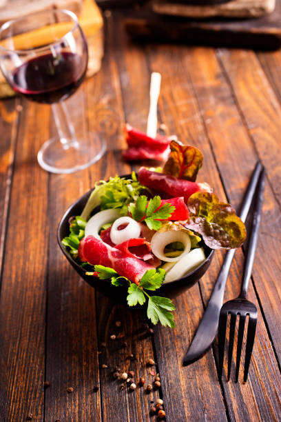 istock salad with jamon and red wine on wooden table 2148882502