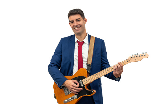 joyful expression of a businessman as he smiles while playing an electric guitar. Embracing music as a form of leisure and relaxation, he embodies corporate creativity and enjoyment white background