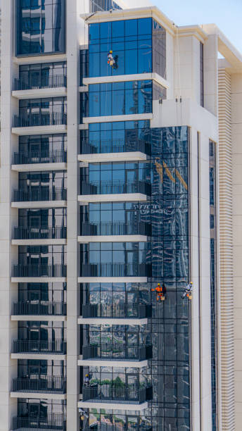 Detail photography on a daytime scenery over the urban city skyline with tall skyscrapers of office and residential buildings in downtown Dubai  modern architecture design of a city during the summer sunny day.