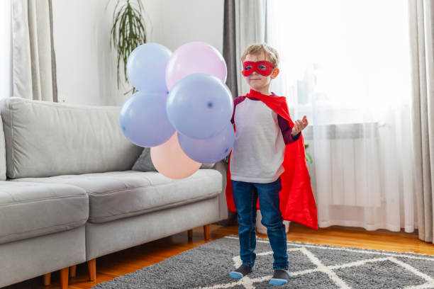 istock Child Superhero with Balloons 2148884489