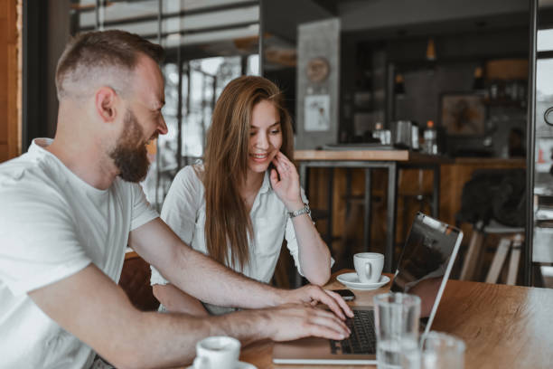 istock Bearded Male Helping Girlfriend Learn Web Design With Him 2148884505