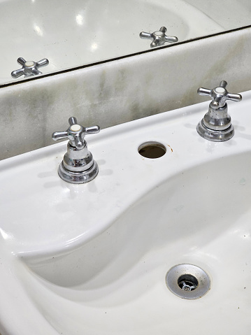 Three stainless steel sinks with fittings