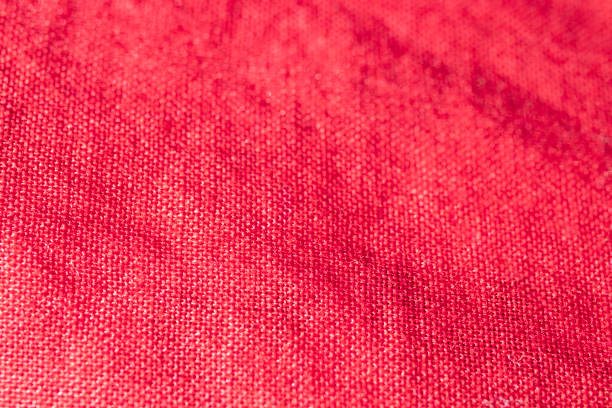 istock organic textured linen fabric background. red colored. 2148885127