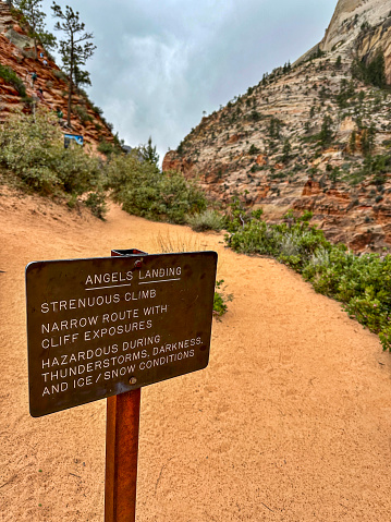 Only those with permits can step past the Angel's Landing sign at Zion National Park in Utah. The hike to Angel's Landing is 5.4 miles roundtrip and gains 1,488 feet in elevation. It is considered one of the most difficult hikes in the United States.