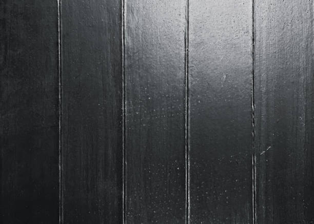 the surface of an old table painted black