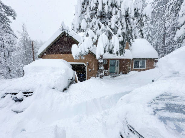 Family at mountain cabin playing in a big snowstorm