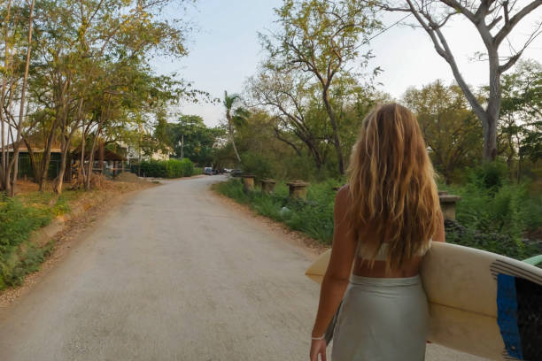 istock Young Woman Walking to the Beach 2148889759