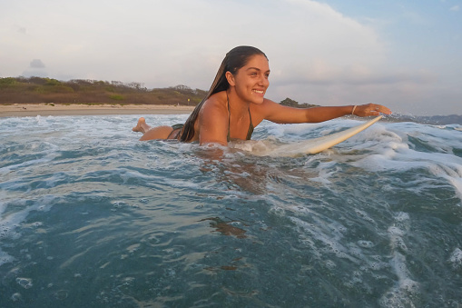 Woman Paddling Out for a Surf
