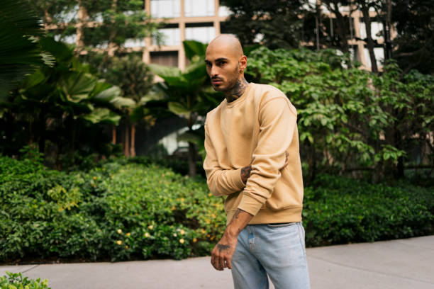 istock Handsome male model posing at city park 2148893394