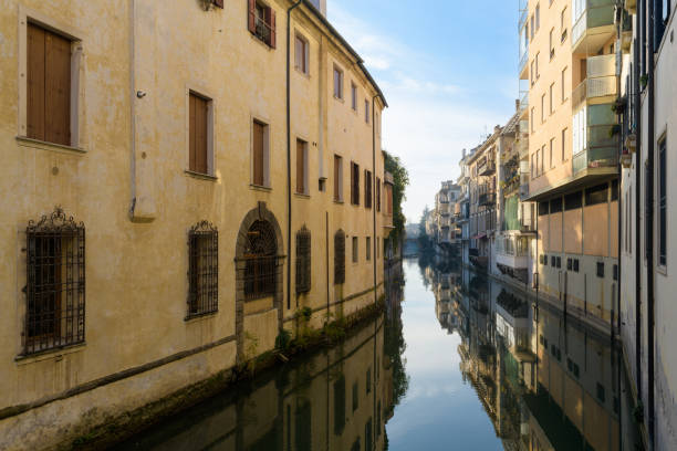 View from Ponte delle Torricelle bridge across canal in Padova, Italy