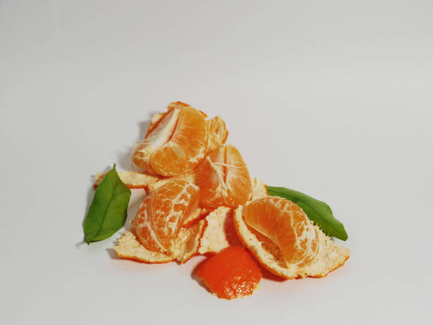 istock Peeled tangerine with peel on a white background. 2148896212
