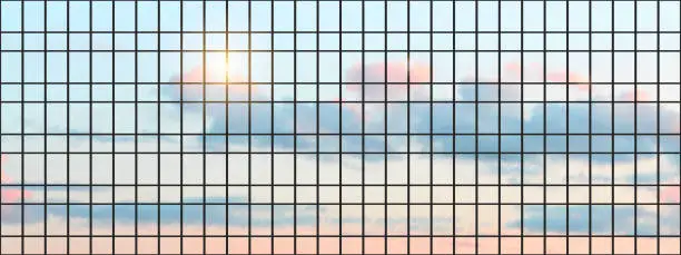 Vector illustration of Sunset sky with clouds reflected in the facade of an office building with panoramic glazing