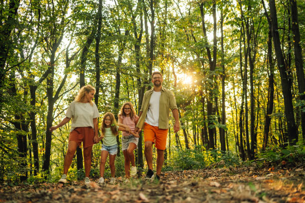 istock An adventurous family is taking a walk and hiking in forest. 2148896523