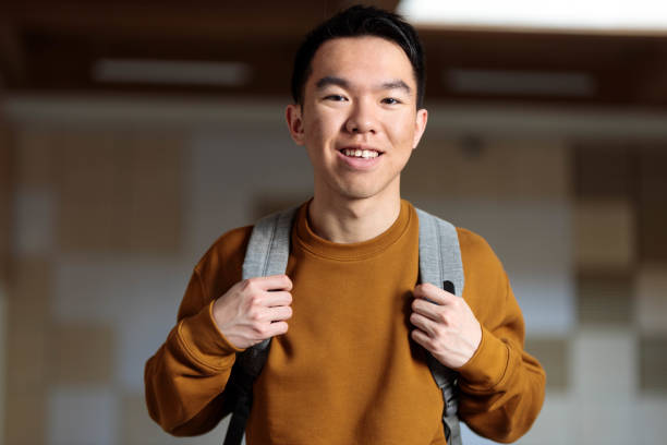 istock Young student in brown sweater with backpack, happy and ready for school 2148896587