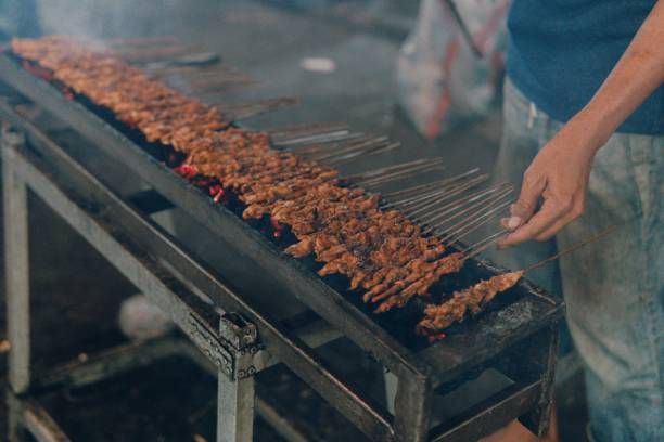 Satay Chicken Chicken satay at the old market in Tangerang. Chicken satay is made from chicken and peanut sauce grilled over hot charcoal. gudeg stock pictures, royalty-free photos & images