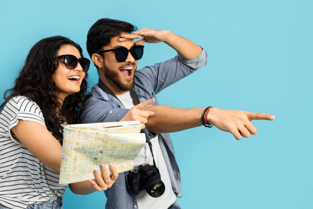 istock Happy Couple With Sunglasses Holding Map On Blue Background 2148897424