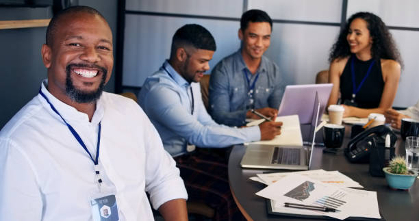 istock Happy, portrait and man at convention for business training or coaching a team with a project proposal. Mature, entrepreneur and mentor of group learning at trade show with information and knowledge 2148900839