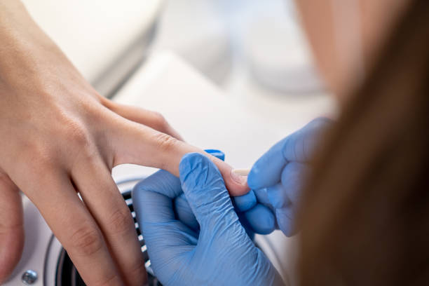 istock Female hands and tools for manicure, process of performing manicure 2148901874