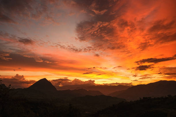Glowing oranges and yellows predominate in the dramatic sky