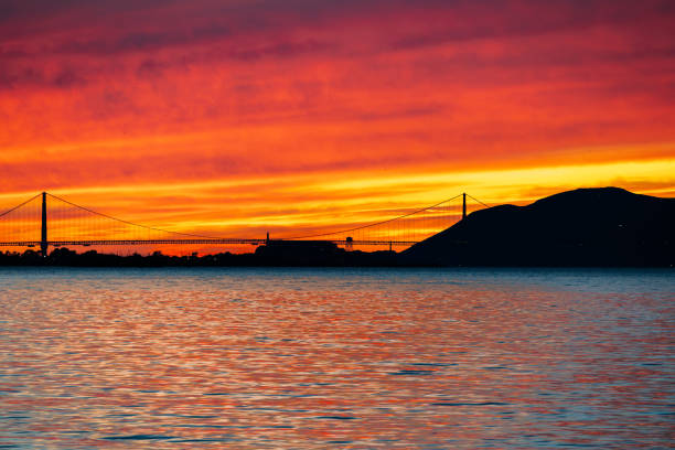 Golden Gate Bridge surrounded by beautiful nature and a spectacular sunset