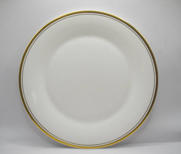 istock porcelain plate with gold rim 2148908407
