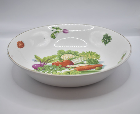 retro style serving bowl with vegetable deisgn