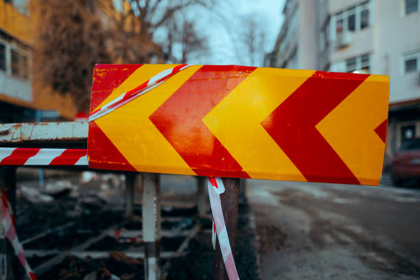 istock Red and yellow Safety Reflective Road Sign on Construction Site 2148910370