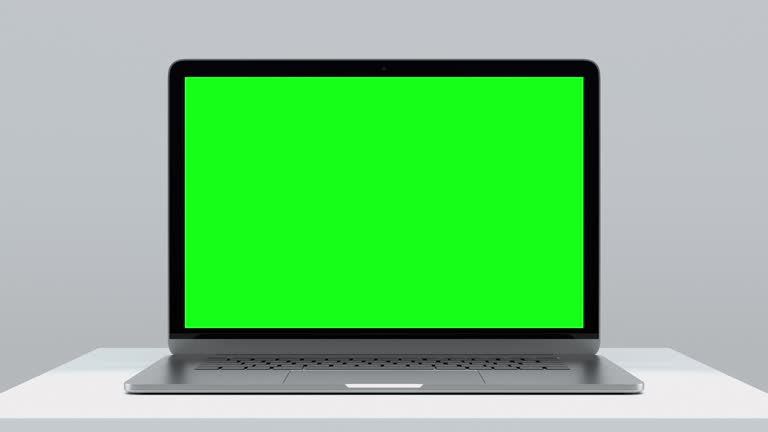 Laptop Computer with Green Screen for Chroma Key. Zoom In on Mock Up of Working PC with Greenscreen for Chromakey on White Color Background. Web Presentation of Electronic Object with Horizontal View