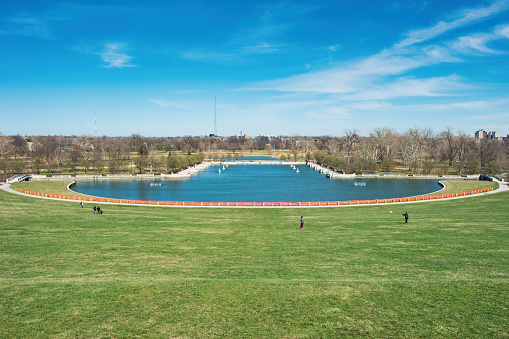People enjoy Forest Park in St Louis, Missouri, USA on a sunny spring day.