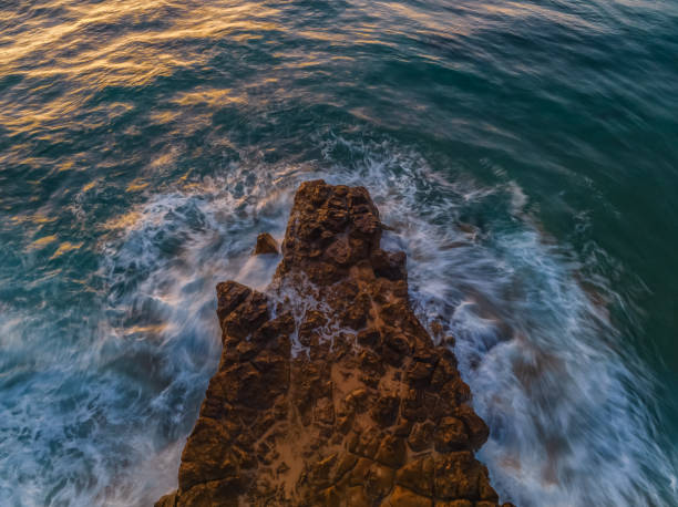 istock Top down sunrise over the sea and rock platform 2148912395