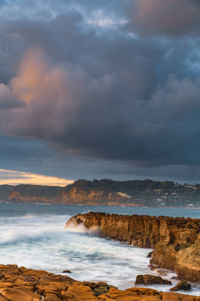 istock Sunrise, sea, waves, clouds and tessellated rock platform 2148912899