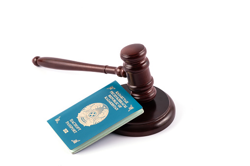 Judge's gavel and passport of a citizen of the Republic of Kazakhstan