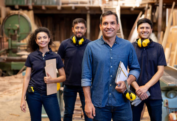 istock Group of employees working at a timber factory 2148914805