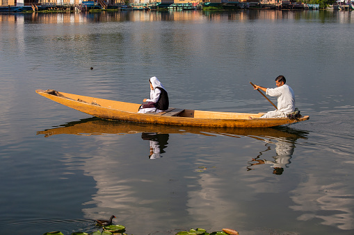 Srinagar, India - july 02, 2015 : Lifestyle in Dal lake, local people use Shikara, a small boat for transportation in the lake of Srinagar, Jammu and Kashmir state, India