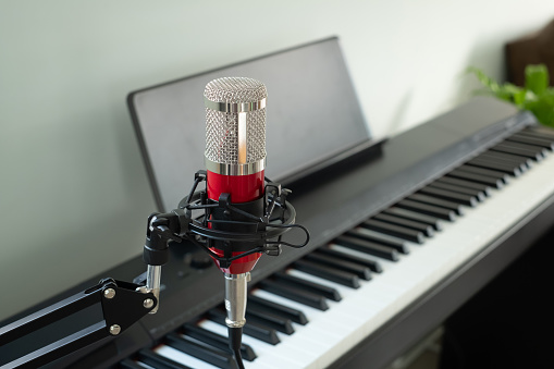 Red microphone for singing with the piano