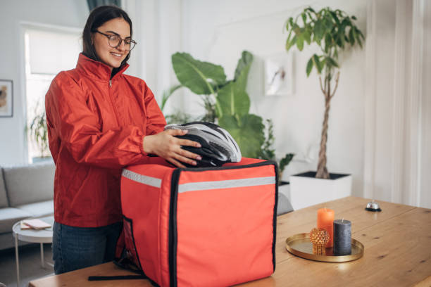 istock Female Delivery Person Preparing for Assignments 2148918541