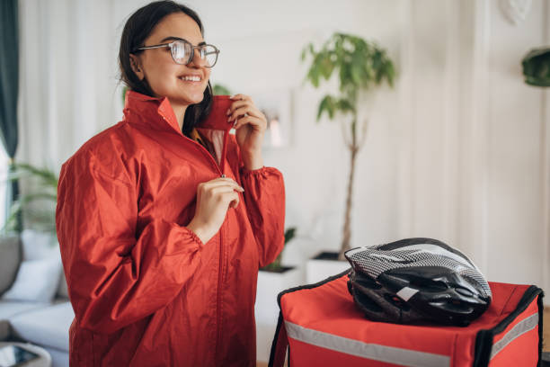 istock Female Delivery Person Preparing for Assignments 2148918599