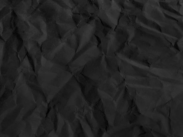 istock black wrinkled paper texture. crumpled paper 2148918687