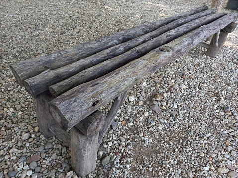 Long bench made of wood, suitable for the garden
