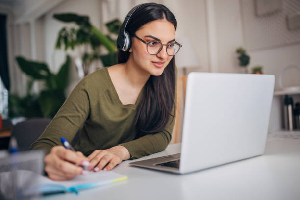 istock Young woman listening online class 2148921063