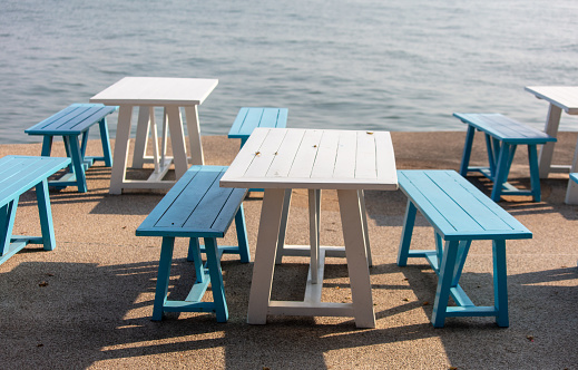 Wooden benches on the seashore.