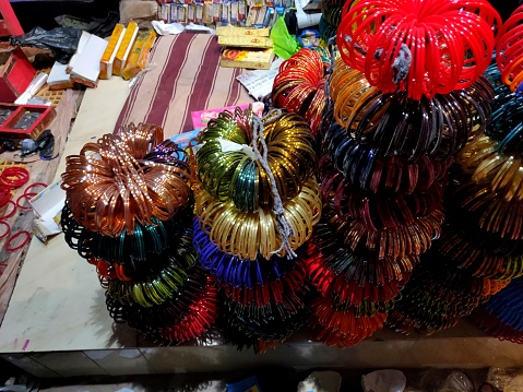 A bundle of colorful bangles on sale along the roadside in an Indian village Explore Fancy Bangles