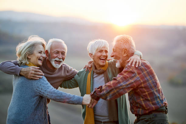 istock Happy embraced friends talking in nature at sunset. 2148923022