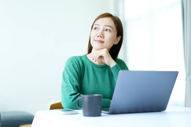 istock Woman working on laptop computer at home. 2148923257