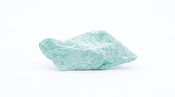 green Fuchsite, also known as chrome mica, is a chromium rich variety of the mineral muscovite, belonging to the mica group of phyllosilicate minerals. isolated on white background