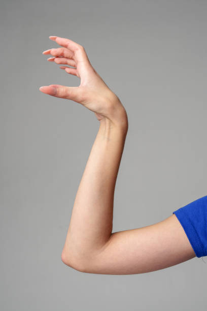 istock Female hand sign against gray background in studio 2148925396