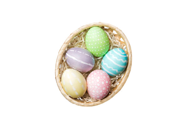 istock Basket of colorful Easter eggs isolated on white background. Easter basket filled with colored eggs top view holiday concept 2148925864