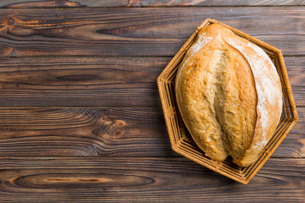 istock Freshly baked bread on basket against natural background. top view bread copy space 2148925881