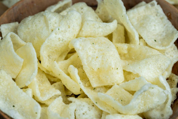 istock crispy potato chips with spices on the table 2148927166